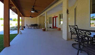 Covered patio area with outdoor seating
