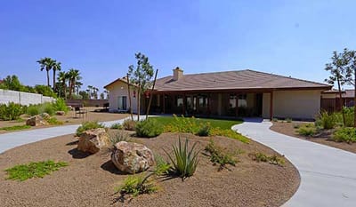 Exterior view of Mimi’s Care Home with landscaped garden