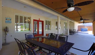 Patio area with seating and outdoor fans