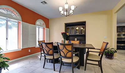 Bright dining area with a large table and seating