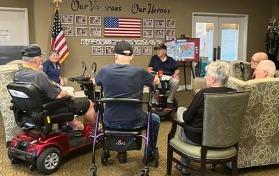 Residents engaged in conversation in a common area