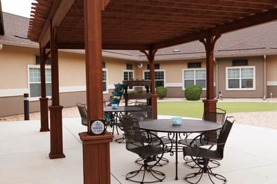 Outdoor seating area with tables and chairs
