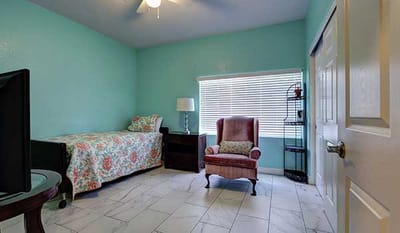 A cozy private resident room in Mimi's Care Home