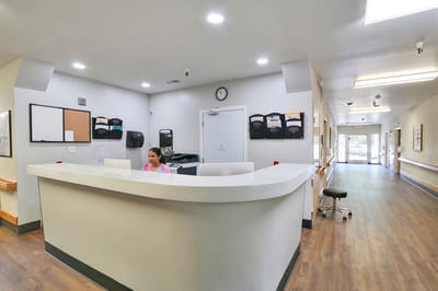 Reception area with staff attending to residents