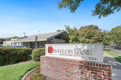 Exterior view of Saylor Lane Healthcare Center sign
