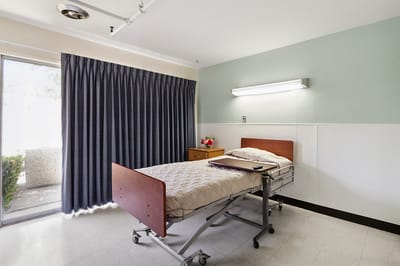 A resident room with a bed and window