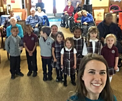Residents and children interacting in a common area