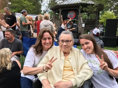 Residents and staff enjoying an outdoor event together