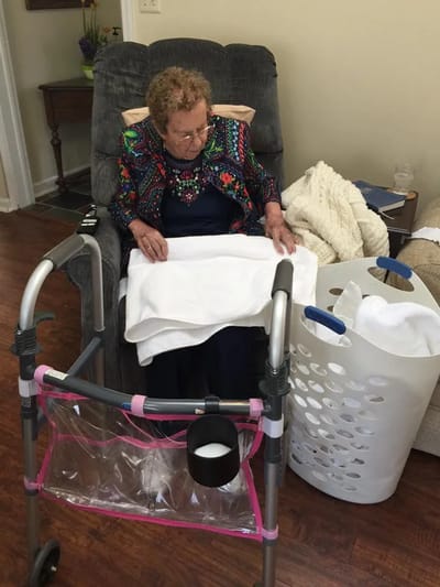 Senior resident engaging in an activity at home