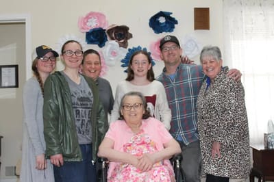 Family gathering with a resident in a warm interior