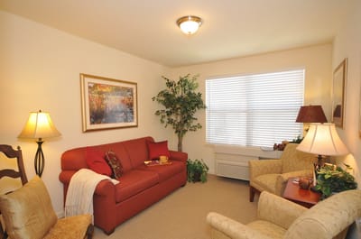 A cozy resident living room with comfortable seating