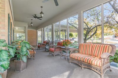Outdoor seating area with plants and comfortable furniture