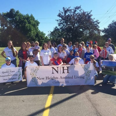 Group of people at a community event with a banner