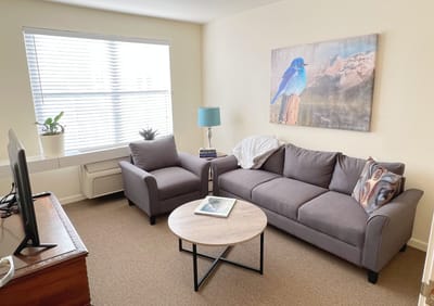 Cozy living area with a couch and artwork
