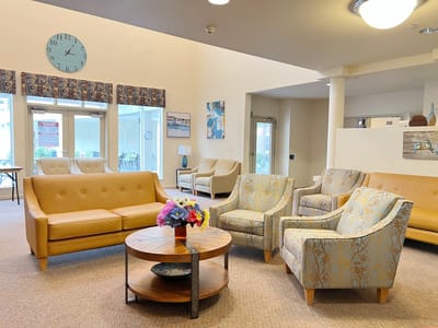 Interior view of a cozy common area with seating and decor