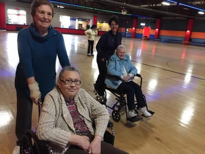 Residents enjoying a recreational activity in a spacious venue