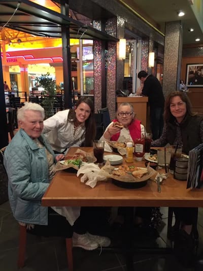 Residents and staff enjoying a meal together