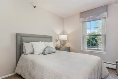 Cozy private resident room with a bed and natural light