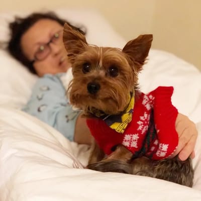 Resident with a dog in a cozy setting
