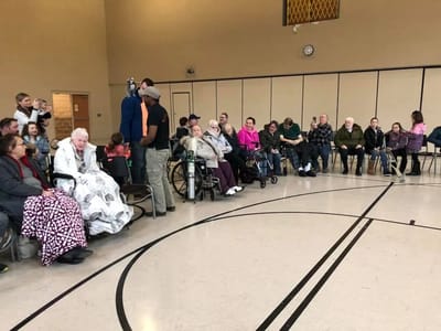 Residents and staff in a common area during an event