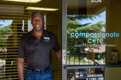 Staff member standing at the facility entrance