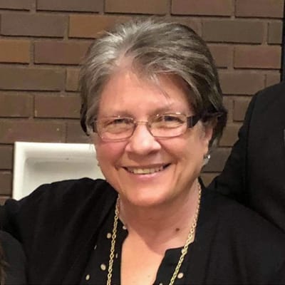 Smiling senior woman in a group setting