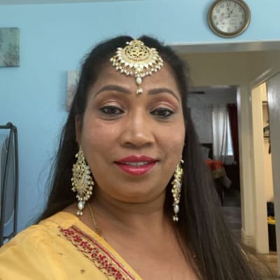 A woman wearing traditional attire and jewelry.