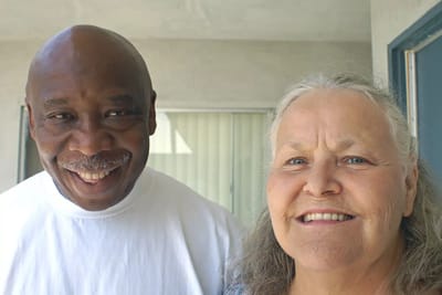 Two smiling residents standing together