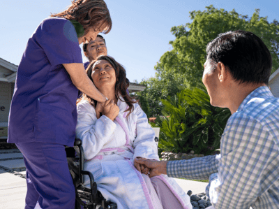 Caregiver interacting with a resident outdoors