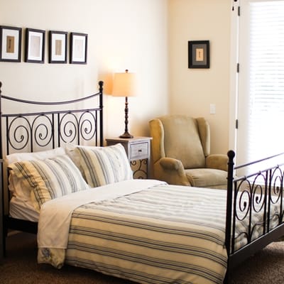 Cozy bedroom setup with a large bed and seating area