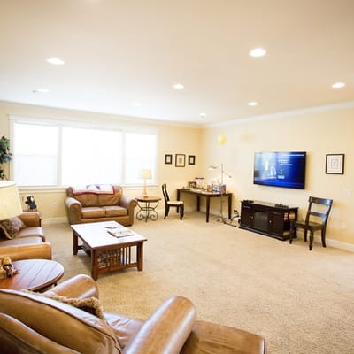 Bright and spacious common area with seating and TV