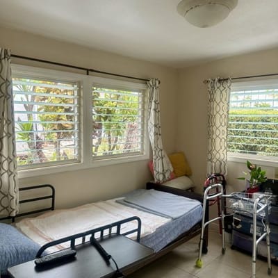 Cozy resident room with bed and walker