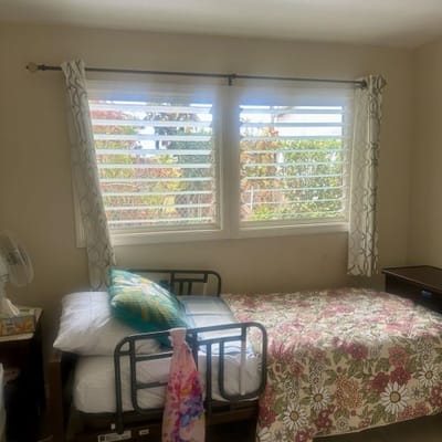 Private resident room with bed and window view