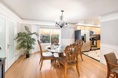 Bright dining area with wooden table and chairs