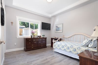 Cozy bedroom with floral bedding and dresser