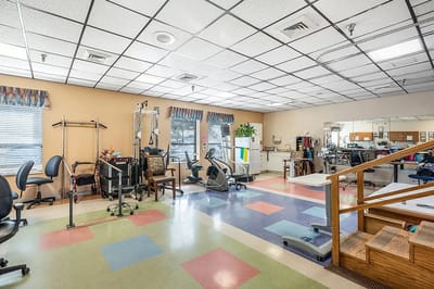 Interior view of a therapy room with exercise equipment