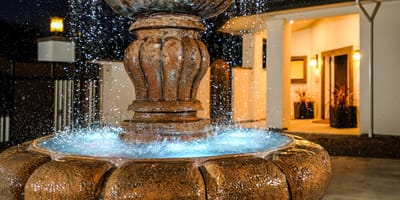 A decorative fountain with illuminated water features