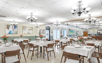 Dining area set up with tables and flowers