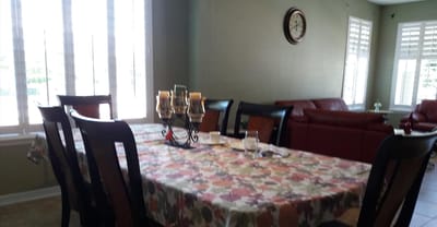 Dining area with a table set for meals