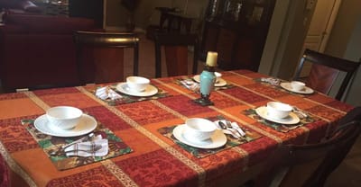 Dining table set for a meal in a cozy dining area