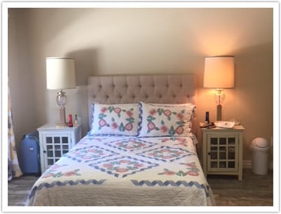 Cozy resident room with a bed and bedside tables