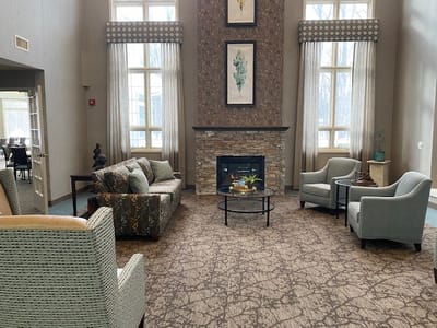 Cozy lounge area with comfortable seating and fireplace