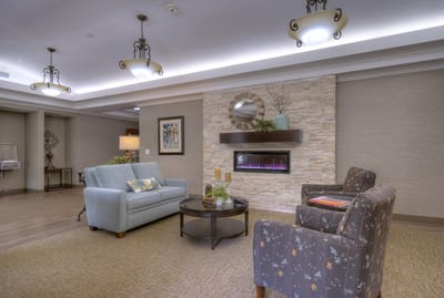 Cozy lounge area with comfortable seating and a fireplace