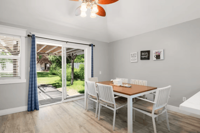 Bright dining area with a view of the garden.