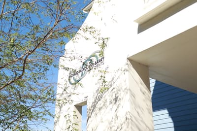 Exterior view of Father Marquess-Barry Apartments sign