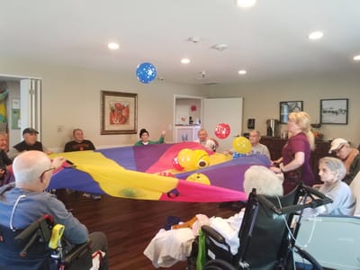 Residents participating in a colorful group activity