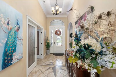 Interior lobby decorated with flowers and artwork
