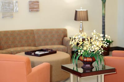 Cozy common area with seating and floral decor