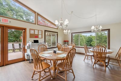 Bright dining room with wooden tables and chairs