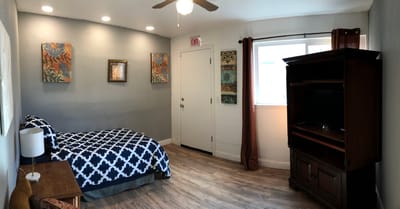 Cozy resident room with decorative artwork and furniture